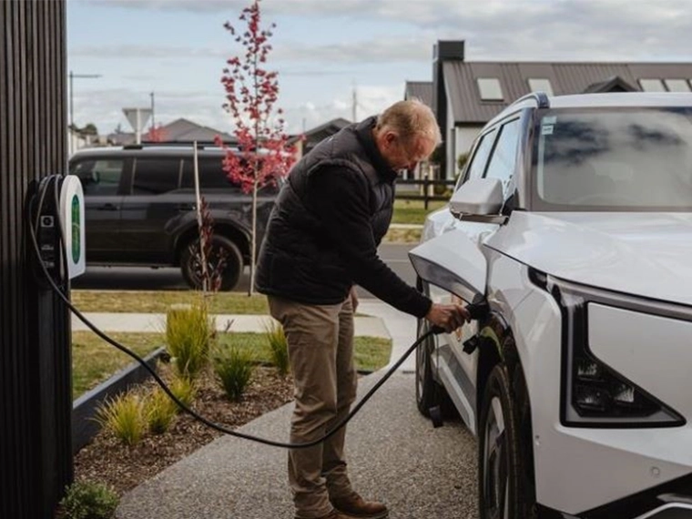 Man using Schneider EV charger at Home