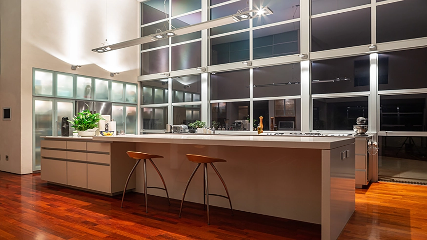 The kitchen in Des Dass’ home with a custom SpaceLogic C-Bus scene activated.