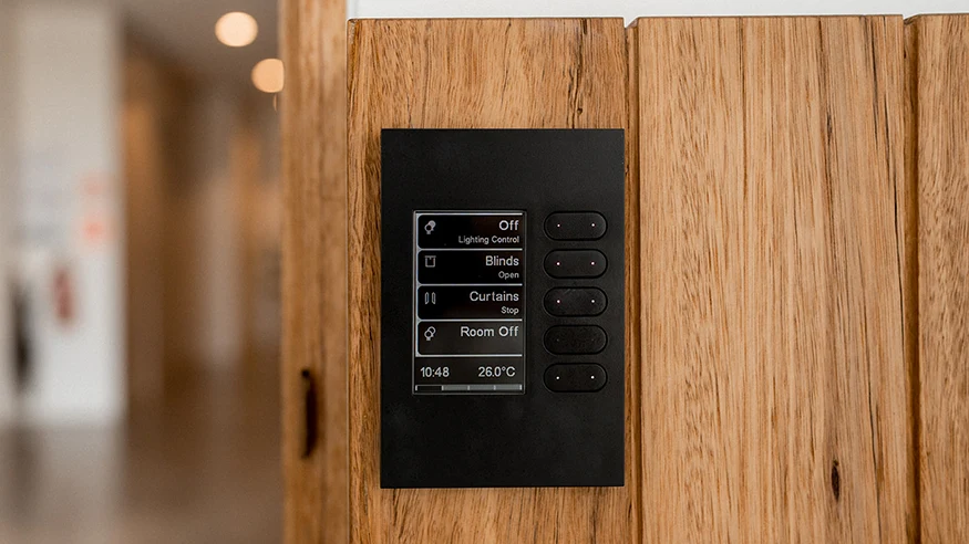 A PDL C-Bus wall plate showing various home systems.