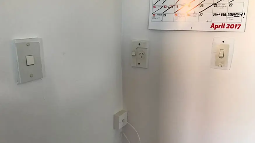 A few old PDL switches installed on a wall in Ben and Quinn’s bungalow home.