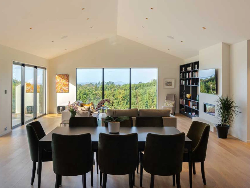The dining room in Alistair and Carol’s home, with a clear view of the wooden floor.