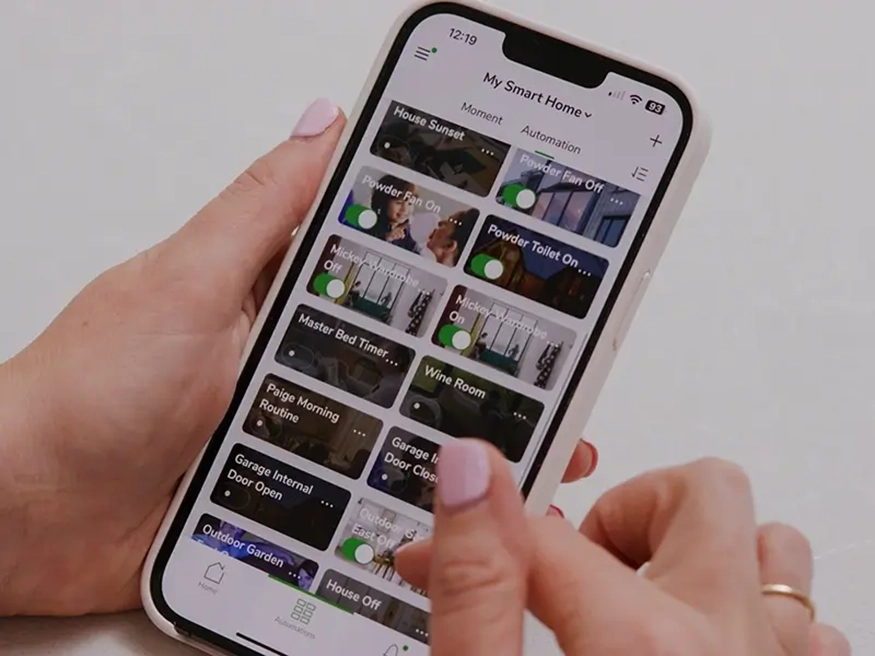 Michaela using the PDL Wiser by SE app on her smartphone.