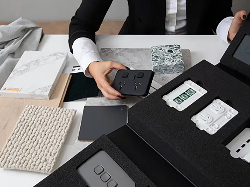 A designer chooses from an assortment of PDL Iconic switches.