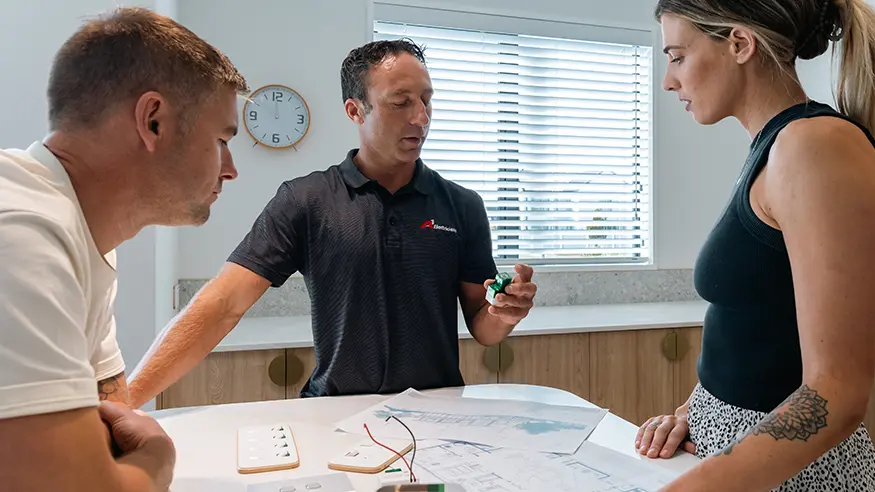 Ben and Quinn consult with electrician Andrew about their home’s electrical plans.