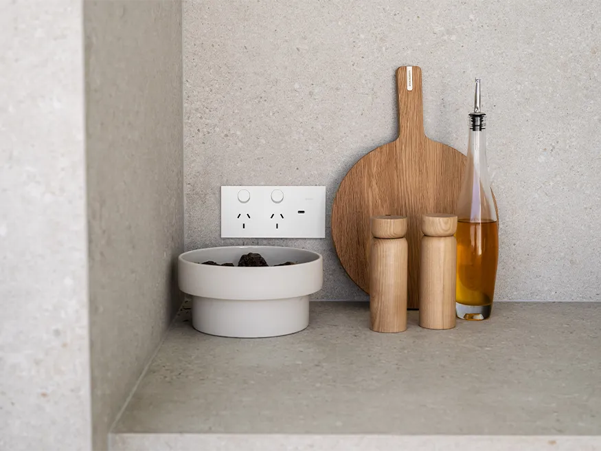 A Clipsal Solis power point in matte white installed in a kitchen.
