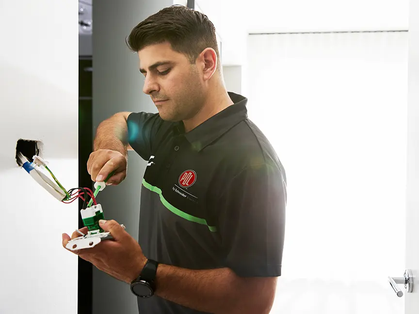 Electrician installing a Wiser Hub.