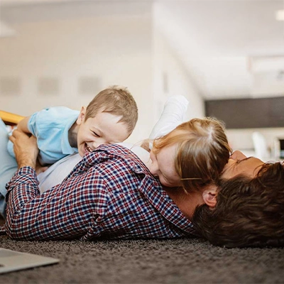 Family laughing on the floor