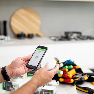 Man using Wiser app on smartphone