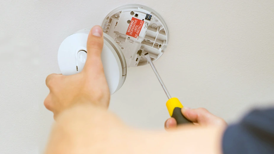 Smoke alarm maintenance by electrician