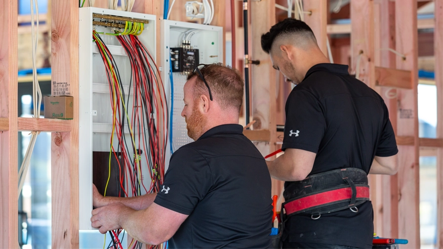 The Johnston Electrical team sorting wires during an installation.