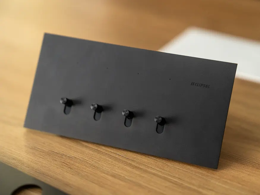 A close up of a Clipsal Solis T Series Ebony Aluminum switch.