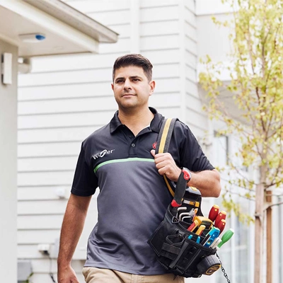 An electrician installing PDL Smart Home solutions in a home.