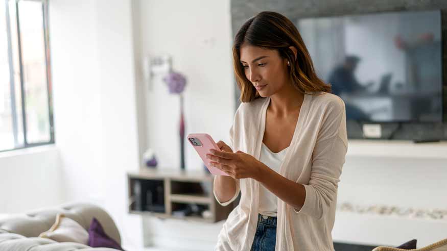 Woman exploring the PDL range through her smartphone