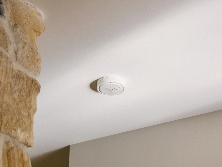 A new PDL Fire Tek Smoke Alarm product installed on a ceiling.