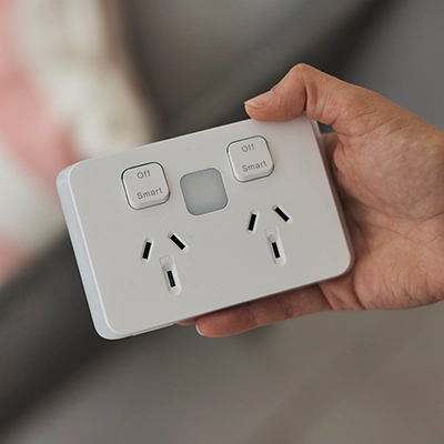 An electrician inspects a PDL Iconic Wiser Connected Socket, a popular product featured in a Club PDL media kit.