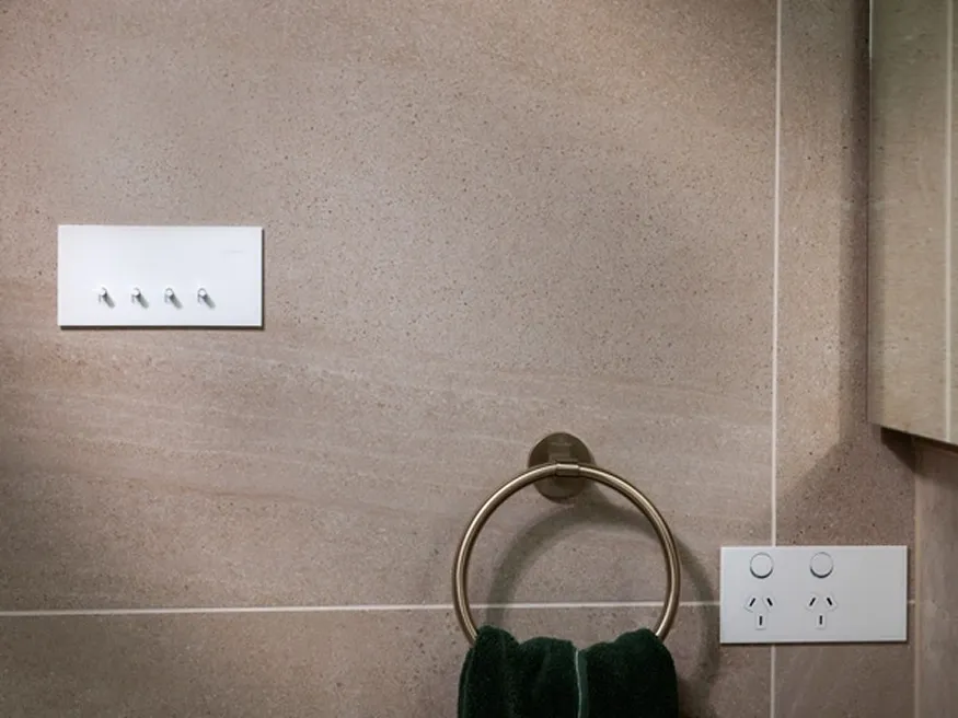 Clipsal Solis switches and power outlets in white.