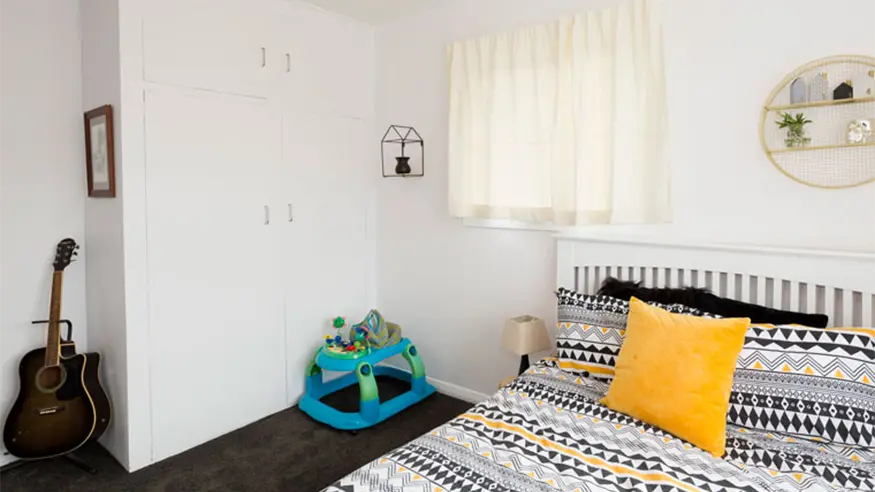 A bedroom in the Ben and Quinn’s bungalow home after renovation.