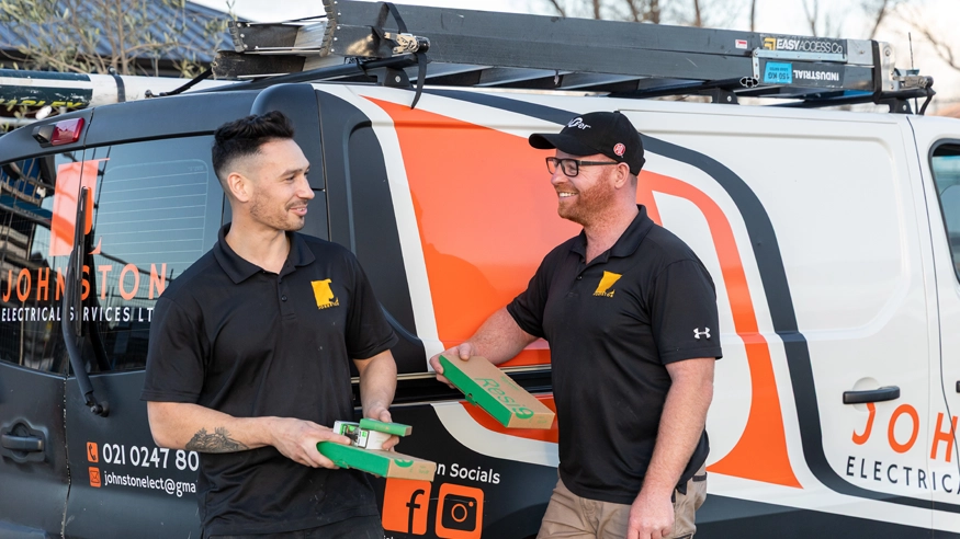 The team at Johnston Electrical holding PDL Resi9 product packages.