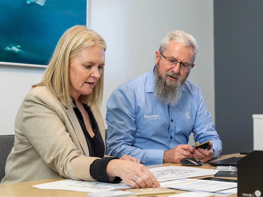 PDL Auckland Vision Studio Consultant Rob discussing electrical plans with a client during an appointment.