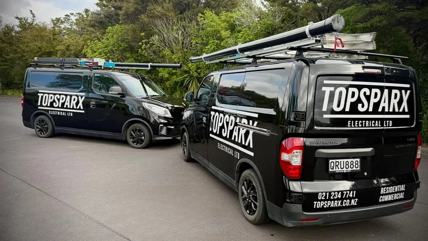 Two work trucks from Top Sparx Electrical.