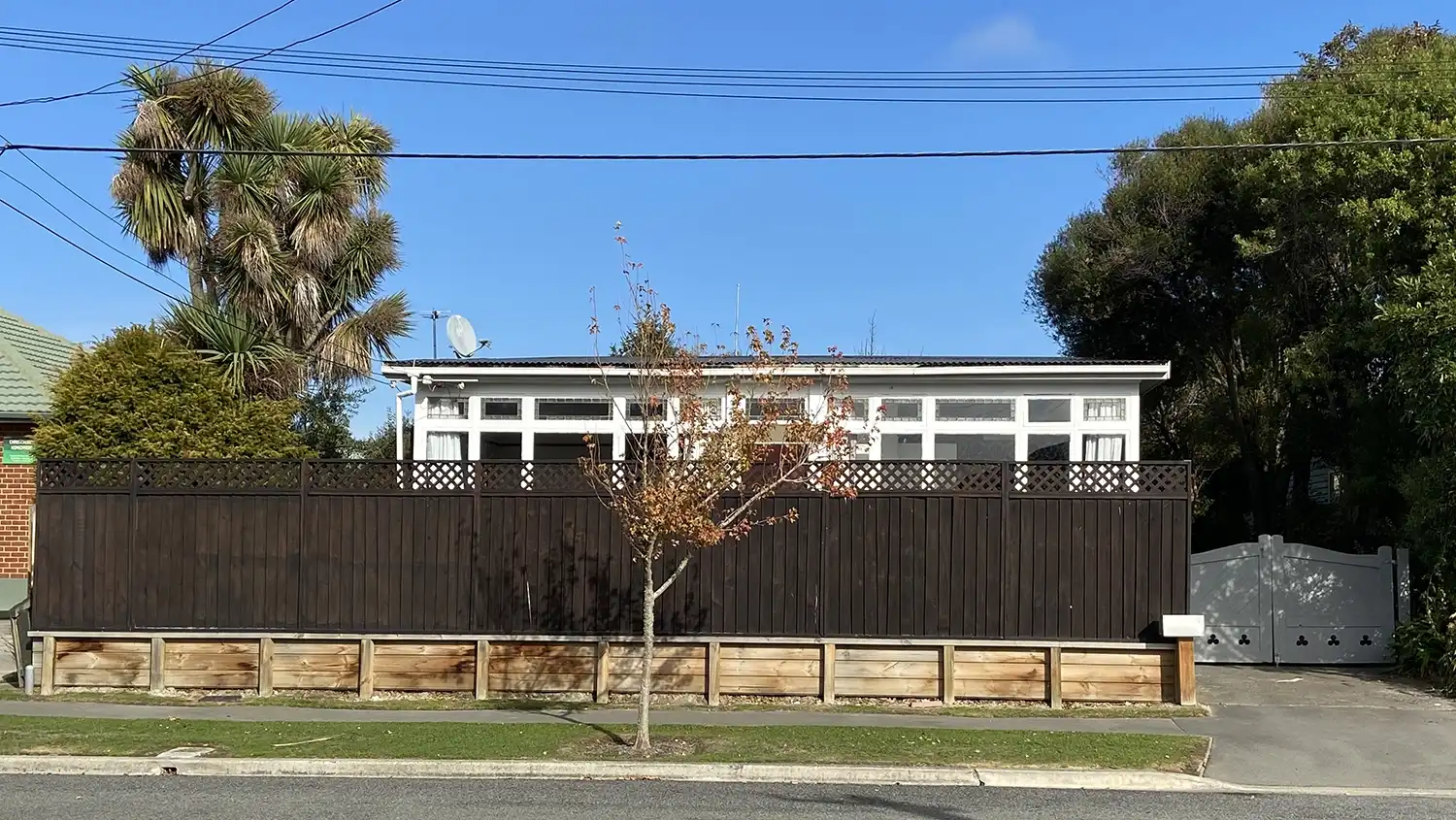 The exterior of the finished Woolston home on a sunny day.