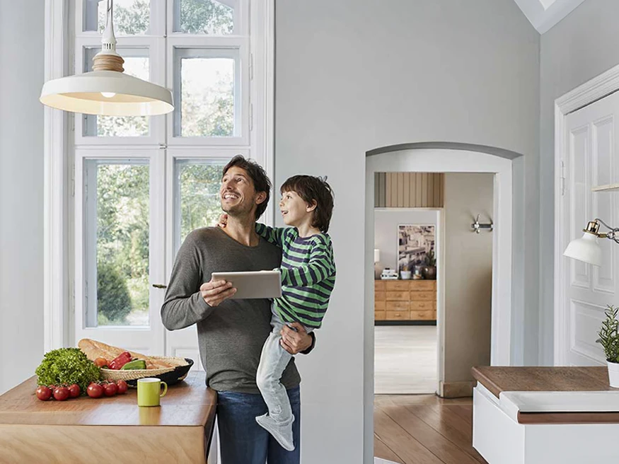 father and child in kitchen