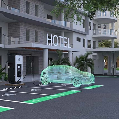 A car charging in a hotel parking lot using Schneider Electric EVlink Pro DC 60 V2.