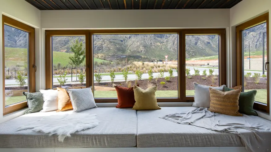 A window in David Reid Homes’ Queenstown show home, showing the scenery outside.