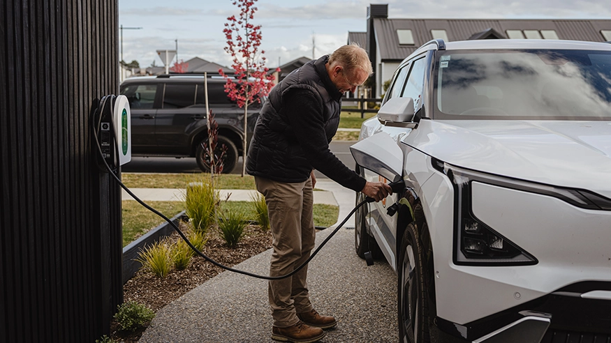 A homeowner using Schneider Charge EV charging solutions.
