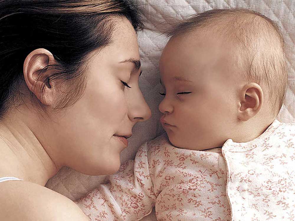Mother and baby asleep