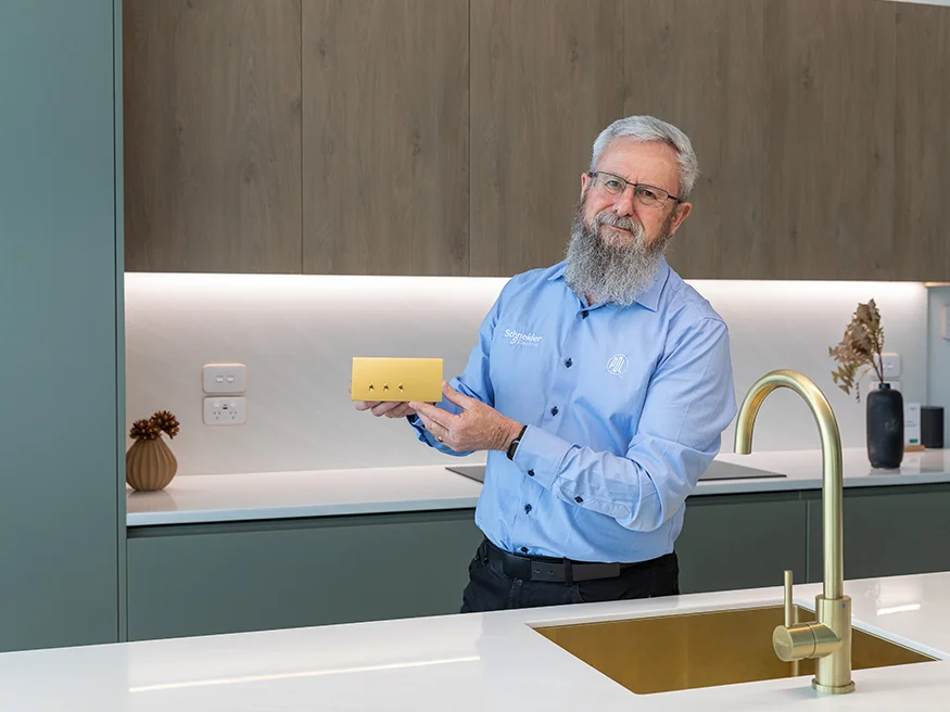 Auckland PDL Vision Studio Consultant Rob with a client in PDL's Auckland Vision Studio Showroom living room.